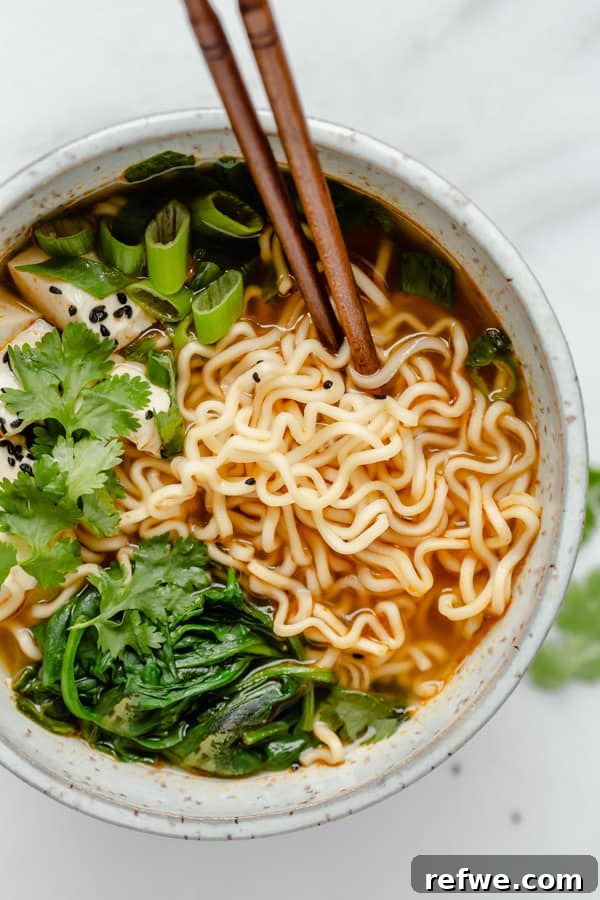 Effortless Vegan Ramen Fix 5 Vegan ramen noodles soup with chopsticks in a bowl