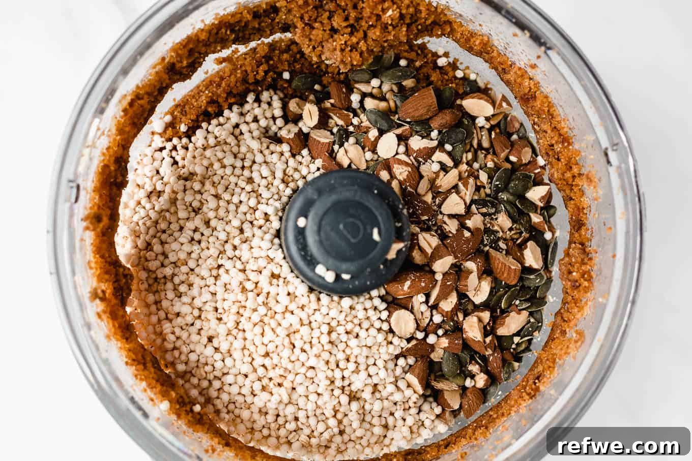 Crispy Quinoa Nut Bars 11 Puffed quinoa and nuts added to the date and peanut butter mixture in a food processor.