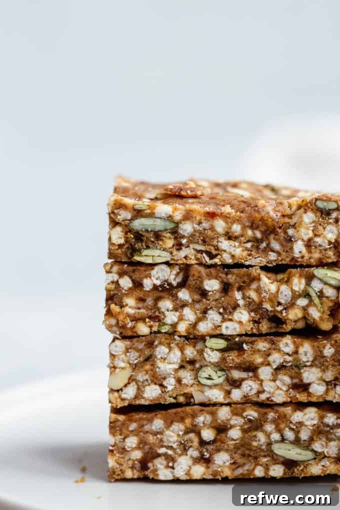 Crispy Quinoa Nut Bars 6 A perfectly stacked arrangement of four puffed quinoa and nut bars, highlighting their appealing texture and snack-ability.