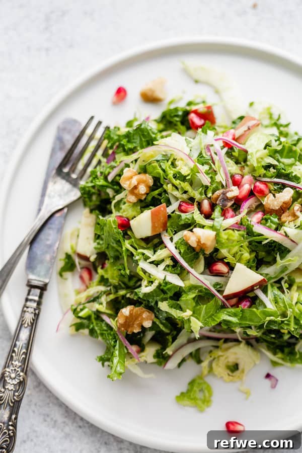 Crisp Brussels Sprout Fennel and Apple Slaw 6 A bowl of Shaved Brussels Sprouts, Fennel & Apple Salad ready to be served