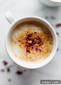 A comforting chai latte in a pristine white mug, symbolizing the warmth and aroma of the drink.