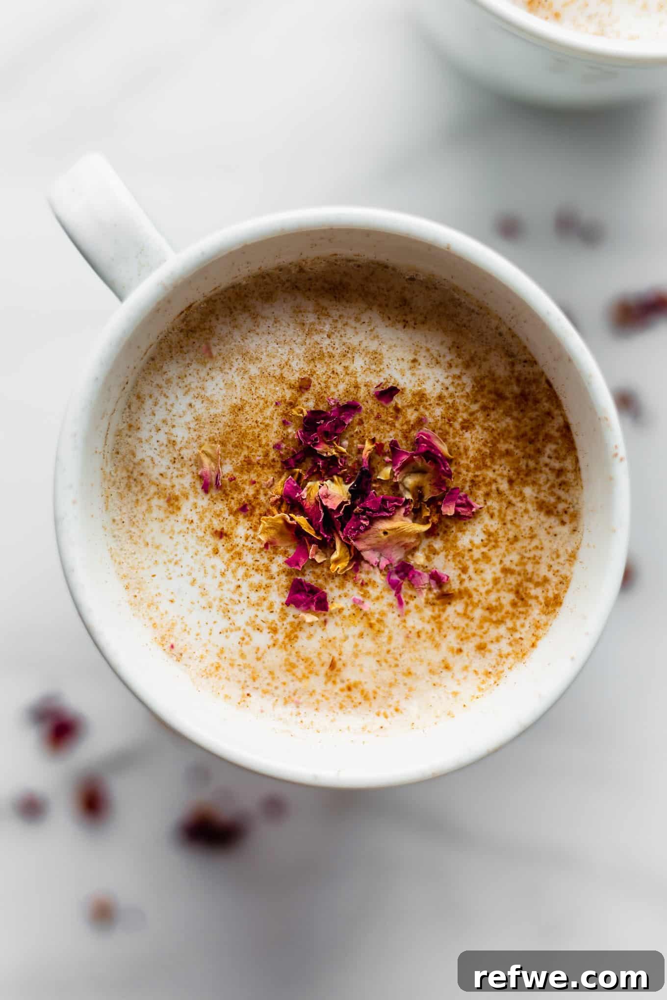 Homebrewed Chai Spice Bliss 8 A beautifully presented chai latte in a white mug, garnished with a sprinkle of cinnamon, inviting warmth and comfort.