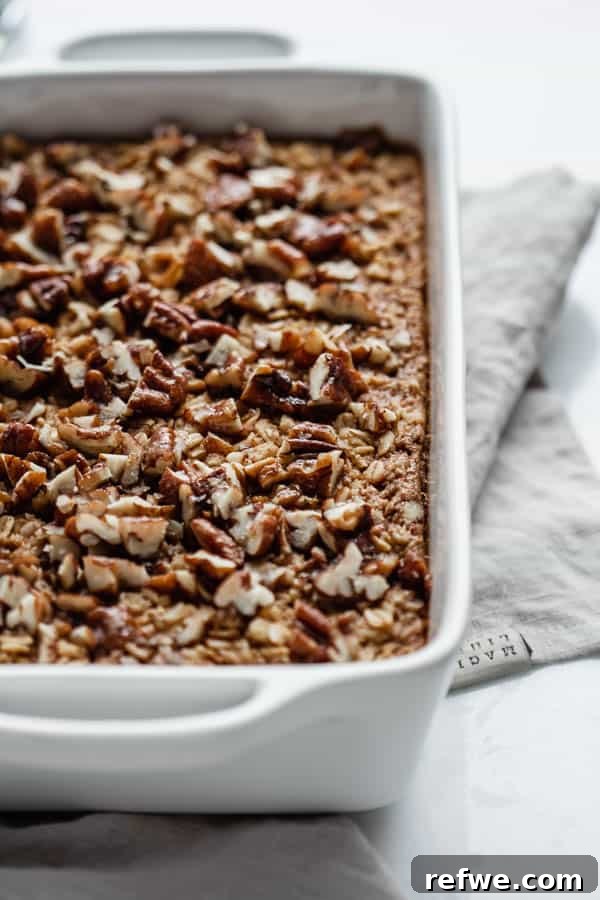 Close-up of pecan pie baked oatmeal with a golden, crunchy topping