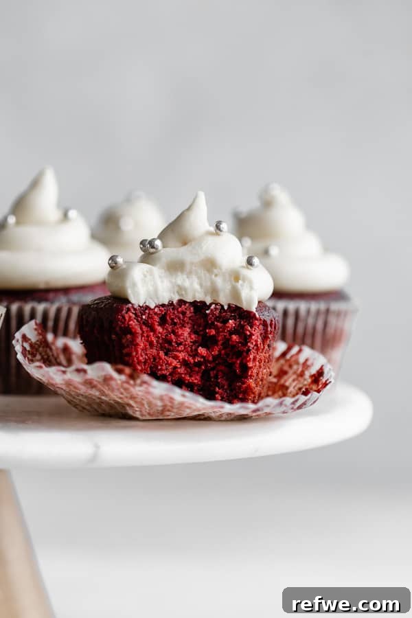 Luscious Vegan Red Velvet Cupcakes 3 a vegan red velvet cupcake with a bite taken out of it