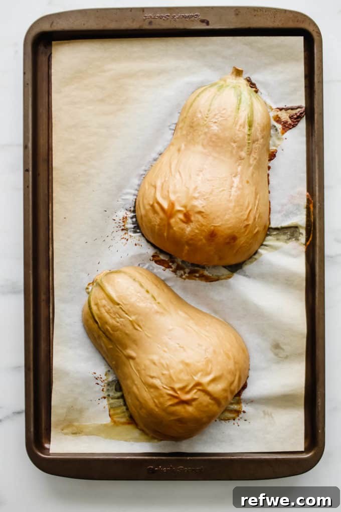 Cooked butternut squash, tender and ready to be scooped out.