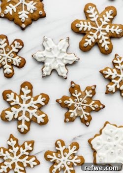 snowflake gingerbread cookies on a marble board