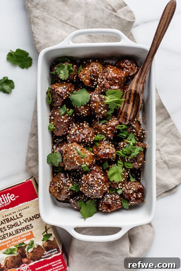 Platter of plant-based sweet and sour meatballs with garnishes
