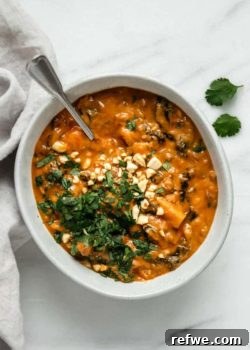 A beautifully presented bowl of creamy West African peanut stew, ready to be enjoyed.
