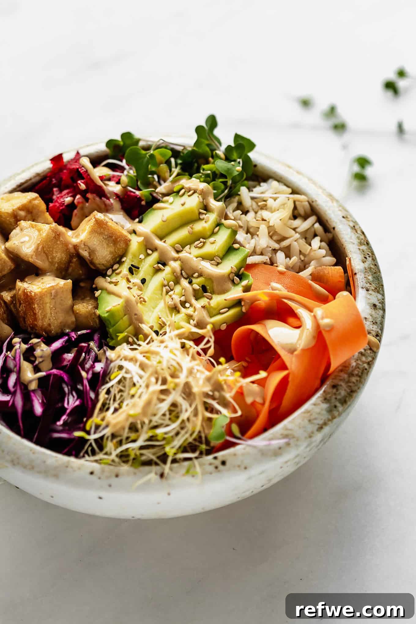 Legendary Dragon Bowls 10 A vibrant and nutritious power bowl showcasing an abundance of fresh vegetables, golden-crisp tofu, and wholesome brown rice, ready to be enjoyed.