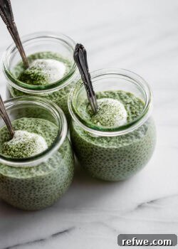 thee jars of matcha chia pudding topped with yogurt.