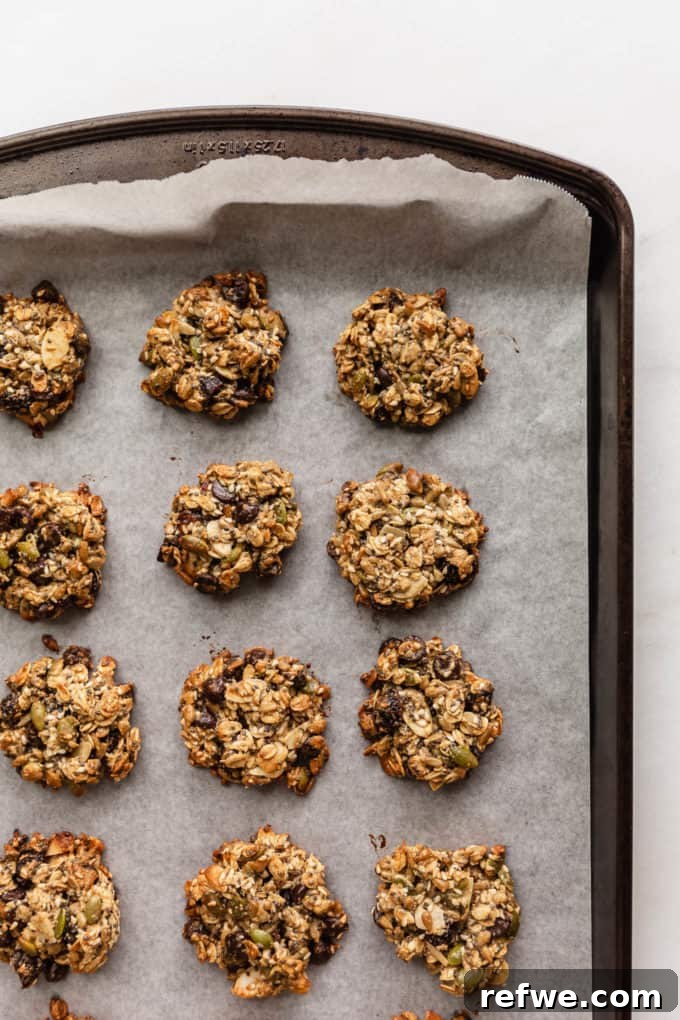 Wholesome Morning Cookie Delights 9 A baking sheet of freshly baked healthy breakfast cookies, golden brown around the edges and perfectly set, cooling after being removed from the oven.