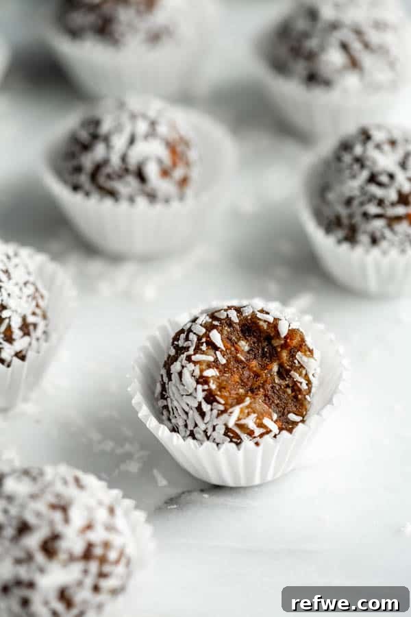 Delicious and healthy Carrot Cake Energy Balls arranged on a plate, showcasing their vibrant color and texture.