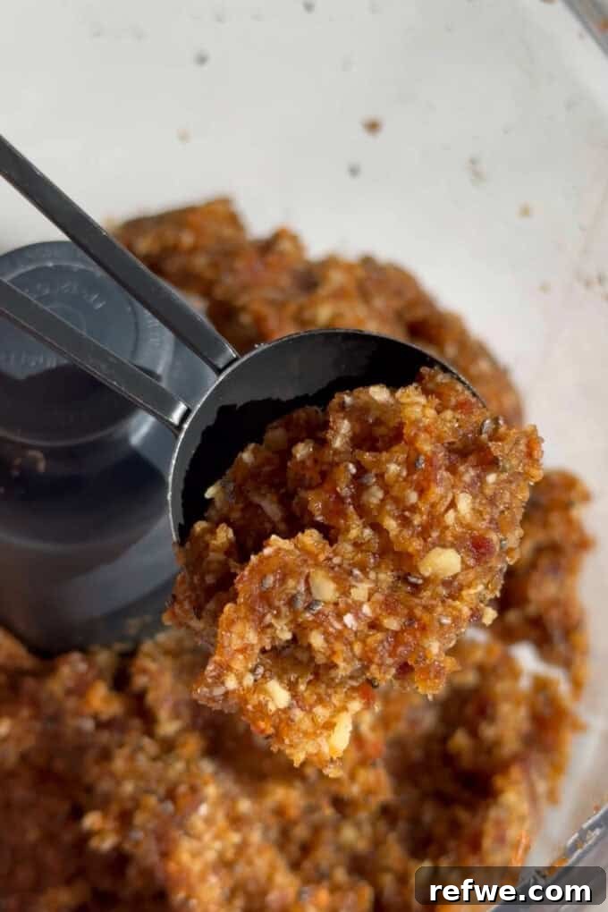 Carrot cake energy ball dough forming in a food processor