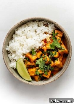 a bowl of curry tofu and rice