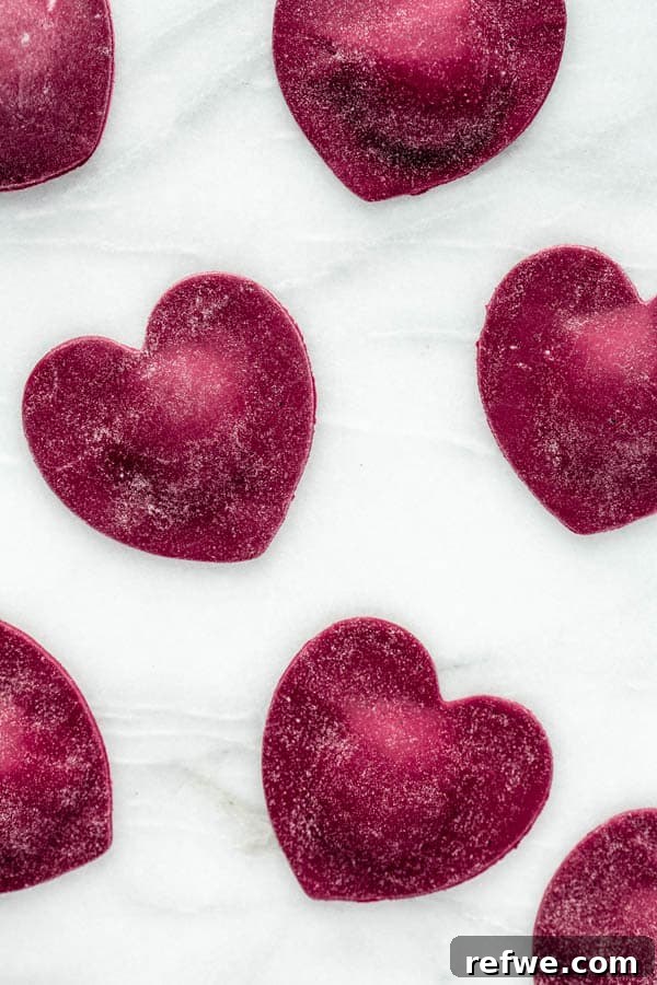 Ruby Heart Ravioli 7 Freshly cut heart beet ravioli, neatly arranged and ready for cooking