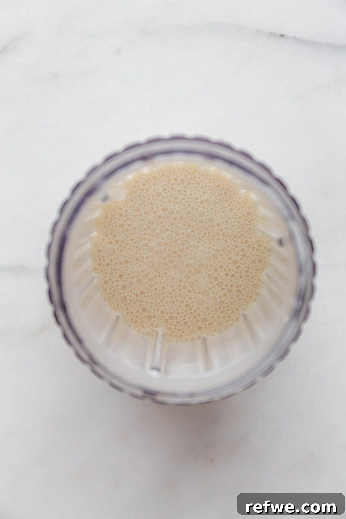 Silky Chocolate Chia Pudding 5 The blended mixture of cottage cheese, coconut milk, maple syrup, and vanilla in a blender container, showing a perfectly smooth and creamy consistency.