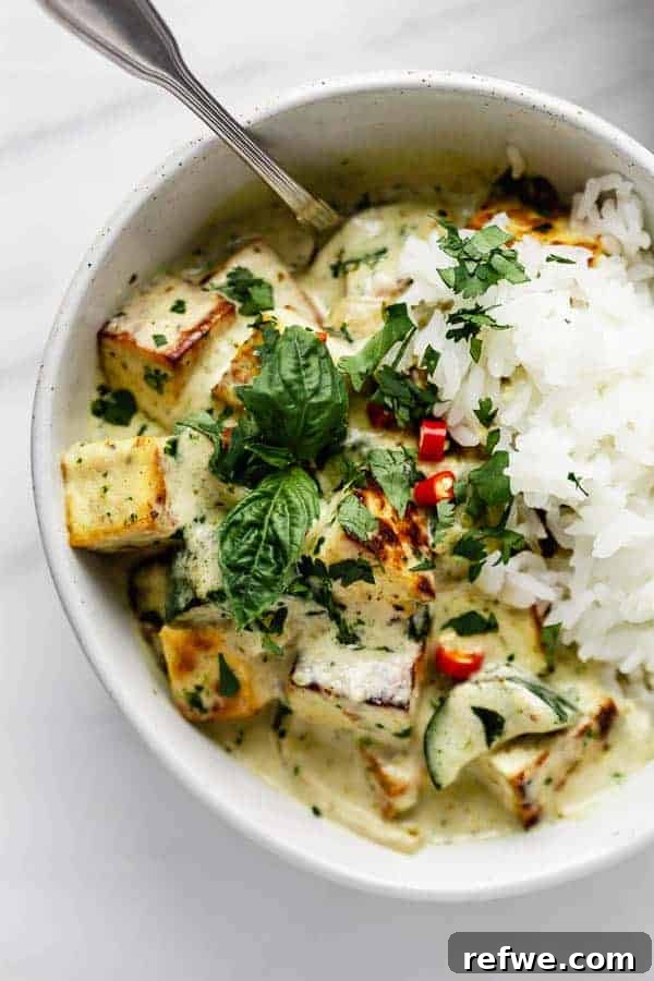 Vibrant Thai Green Tofu Curry 4 Crispy golden-brown tofu cubes arranged on a plate, ready to be tossed into the rich green curry sauce.