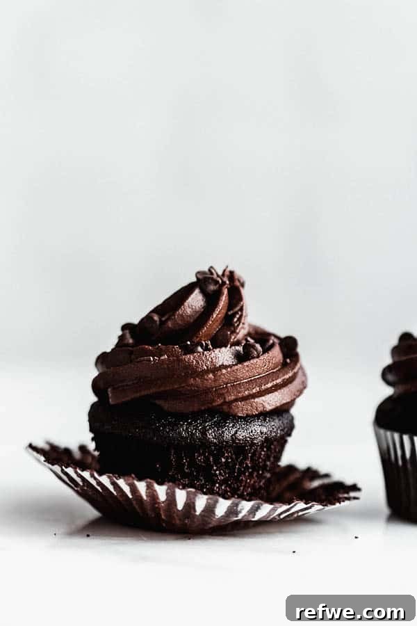 A delightful arrangement of vegan triple chocolate cupcakes, showcasing their rich color and inviting texture, perfect for sharing.