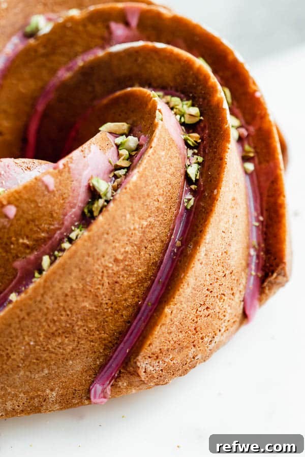 Ruby Glazed Orange Cardamom Bundt 4 An overhead shot of the orange cardamom bundt cake, highlighting the beautiful pink blood orange glaze and delicate design.