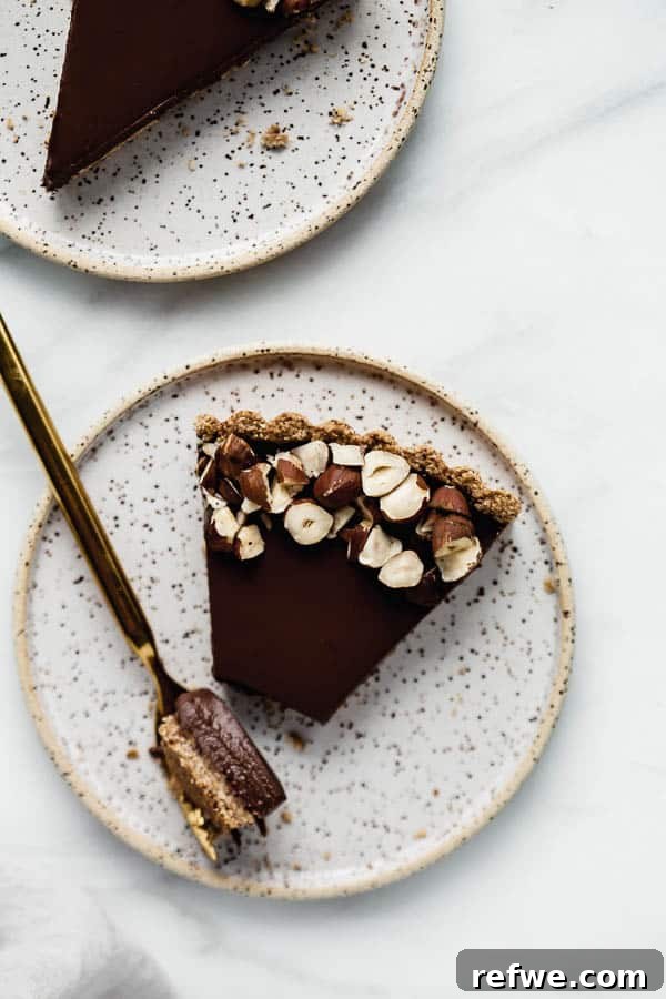 Decadent Vegan Chocolate Hazelnut Tart 5 Close-up of a slice of vegan chocolate hazelnut tart