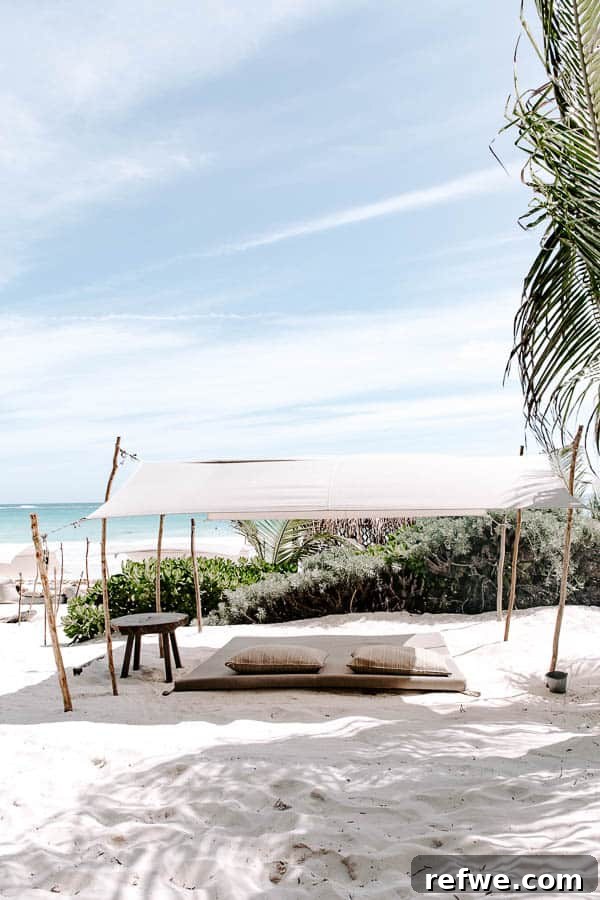 Tulum's Gastronomic Gems: A Foodie's Journey 15 A vibrant beach scene in Tulum with lounge chairs and palm trees