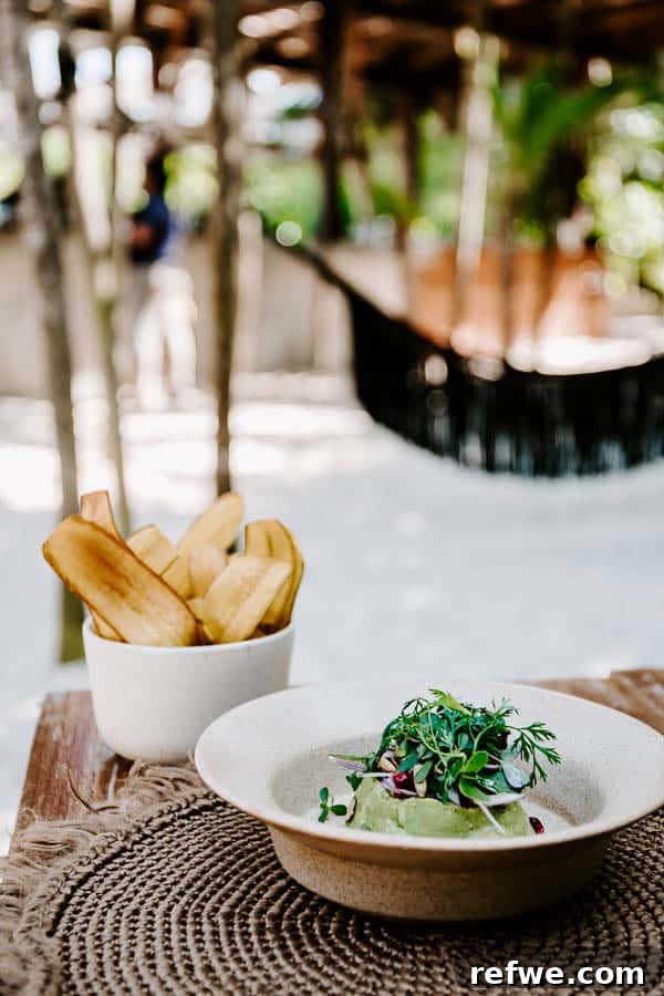 Tulum's Gastronomic Gems: A Foodie's Journey 22 The atmospheric outdoor dining area of Moro Restaurant, illuminated at night