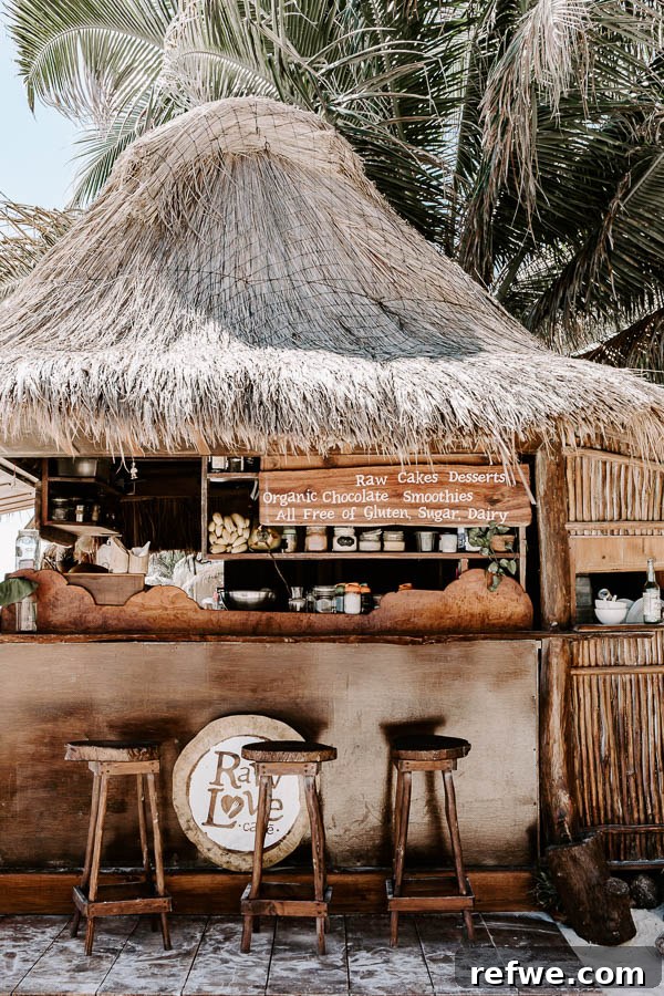 Tulum's Gastronomic Gems: A Foodie's Journey 25 The rustic and inviting entrance to Raw Love beach bar in Tulum