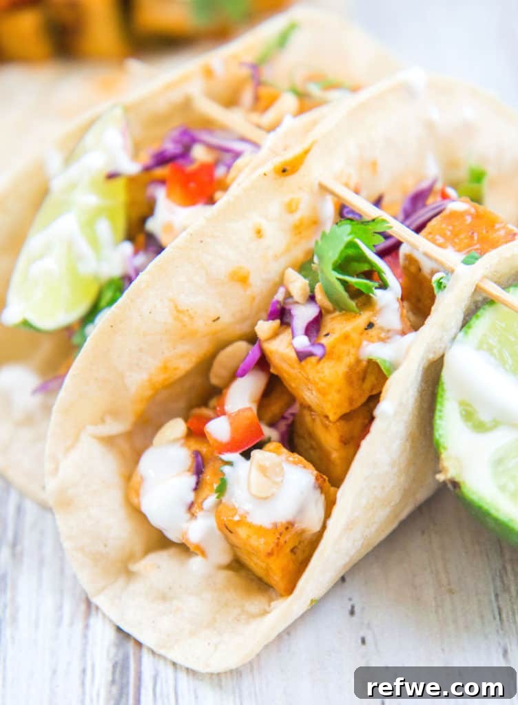 Close-up of Thai Red Curry Tofu Tacos with fresh ingredients