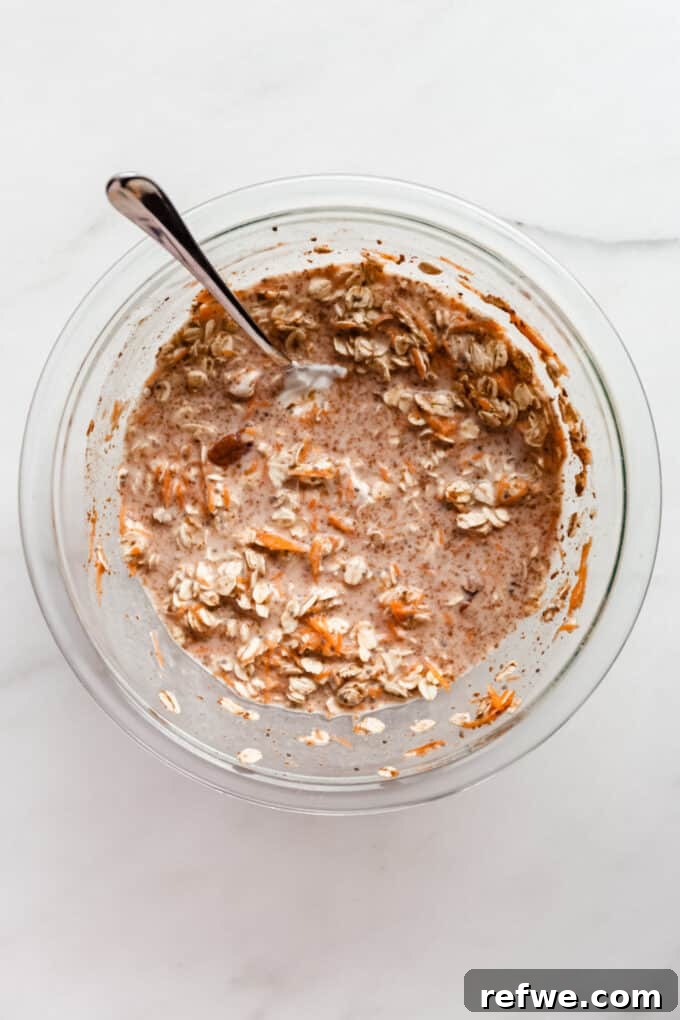 The carrot cake overnight oats mixture after adding liquid ingredients, before being refrigerated.