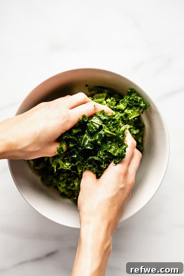 Perfectly Tender Massaged Kale Salad 6 Massaged kale in a bowl, visibly softer and darker, ready for other salad ingredients.