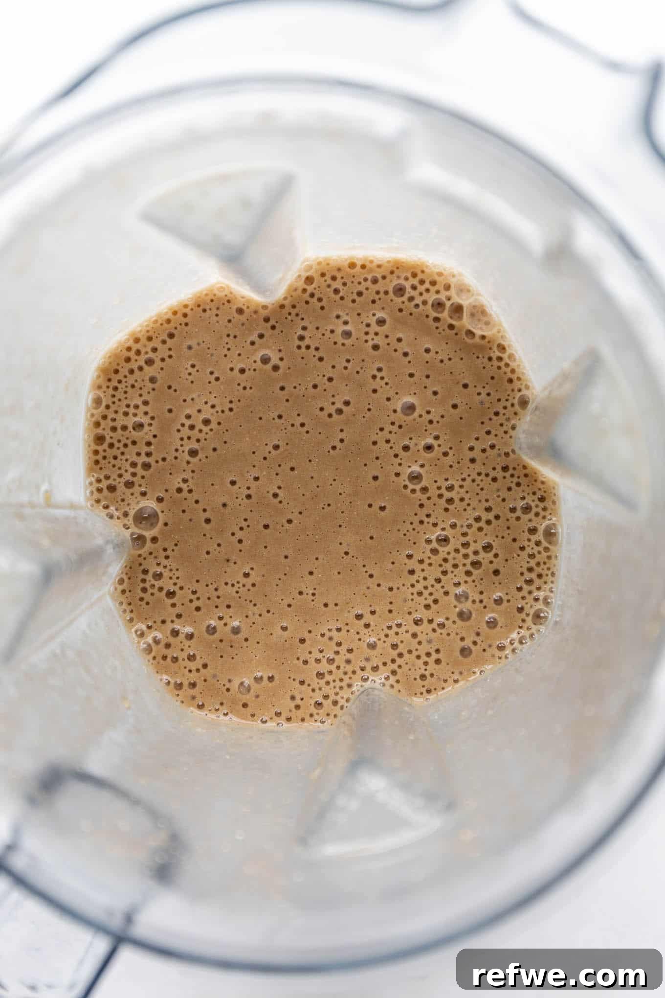Banana Java Blend 5 A banana coffee smoothie being blended until smooth and creamy in a high-speed blender