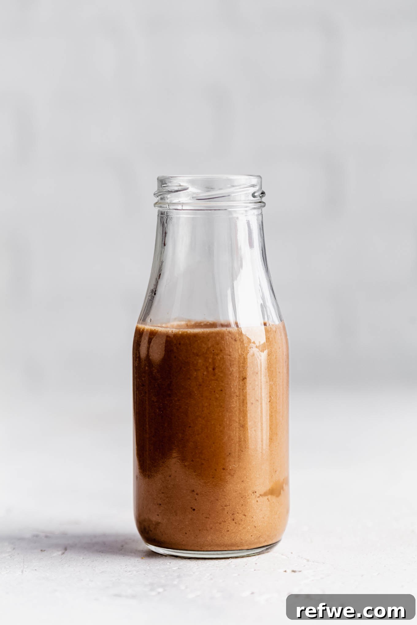 Banana Java Blend 6 A freshly blended banana coffee smoothie poured into a glass jar, ready to be enjoyed