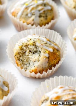 a lemon poppyseed muffin with a bite taken out of it