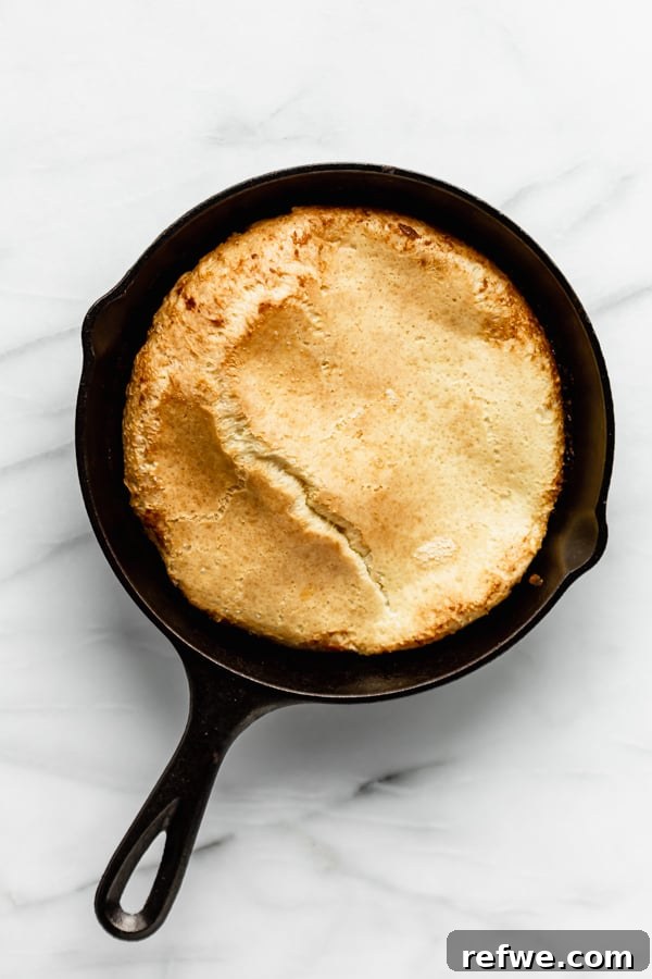 Puffed Skillet Pancake 5 A perfectly baked, wonderfully puffy Dutch Baby Pancake just out of the oven, still in its cast iron skillet, with its golden, crinkled edges high.