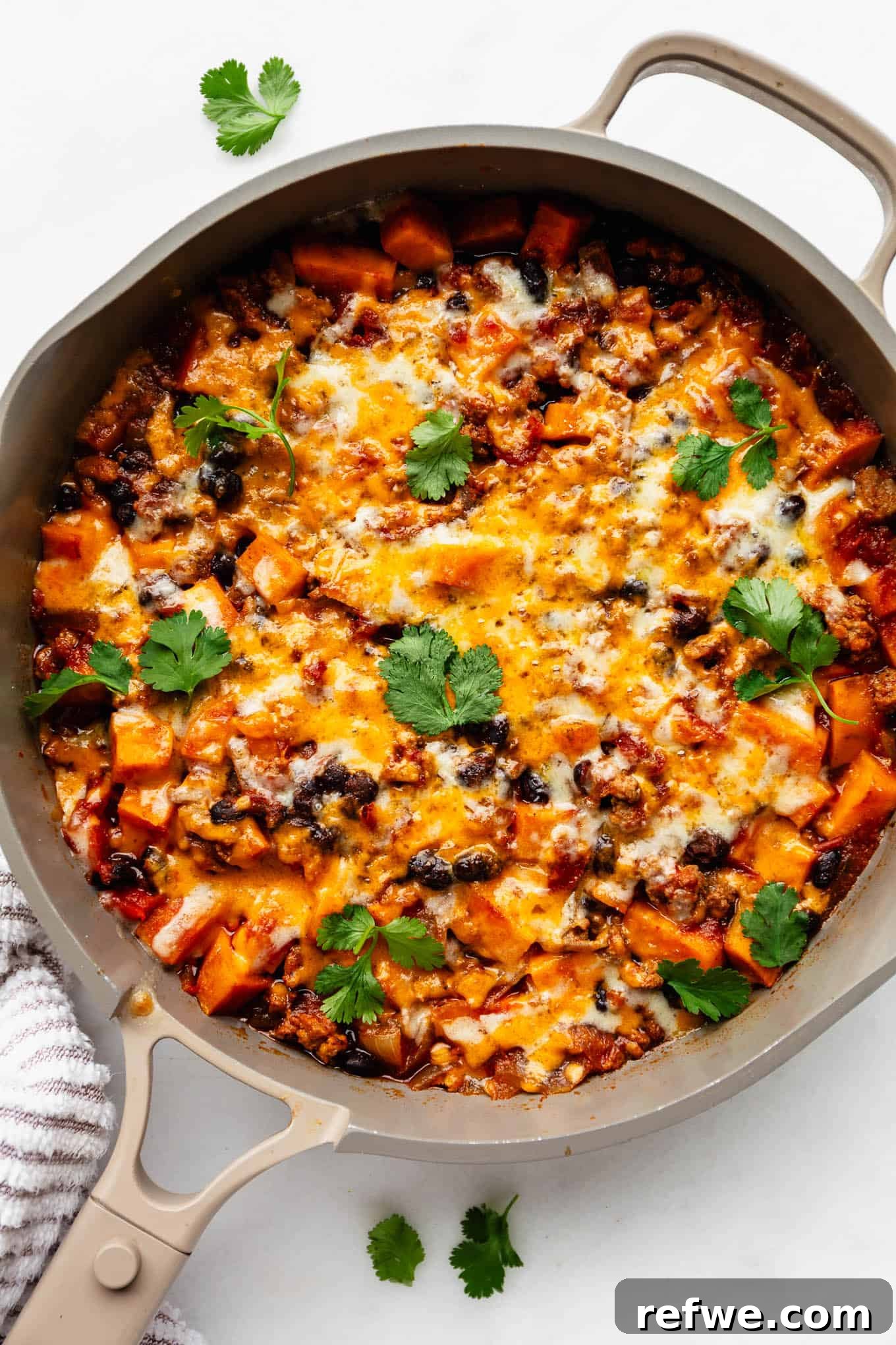 Ground Turkey and Sweet Potato Taco Skillet Recipe 2 ground turkey sweet potato skillet topped with melted cheese and cilantro.