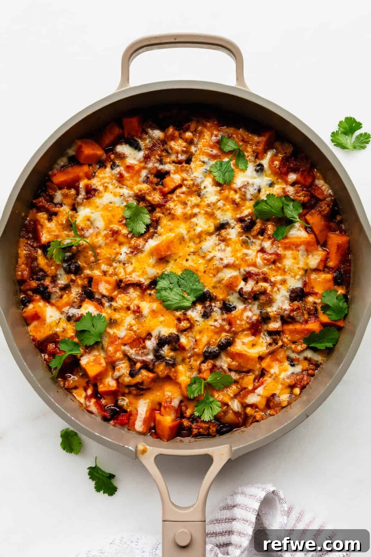 Ground Turkey and Sweet Potato Taco Skillet Recipe 8 Ground turkey sweet potato skillet in a taupe pan.