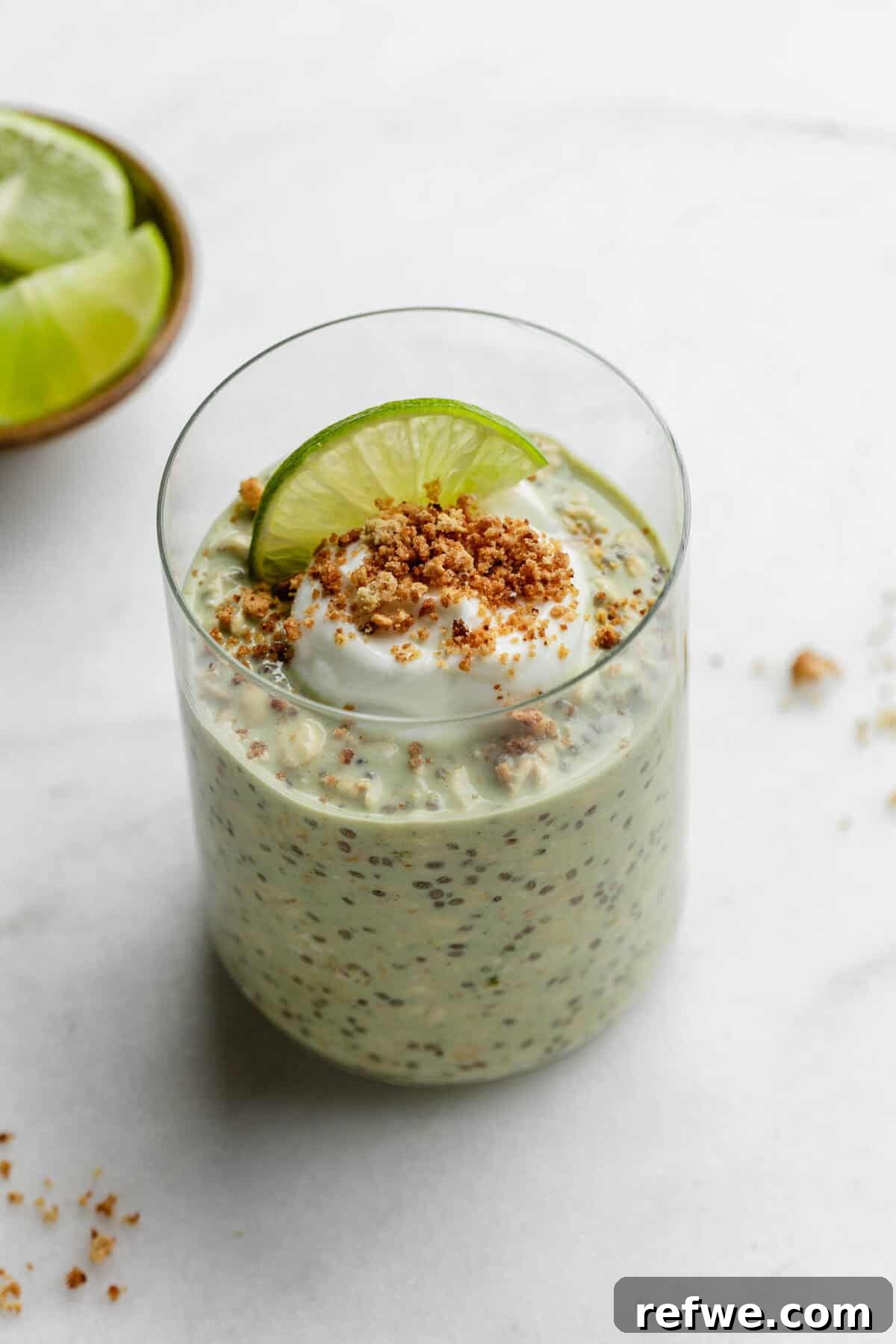 Key Lime Pie Overnight Oats Recipe for Creamy Citrus Breakfast 8 Key lime pie overnight oats topped with yogurt and graham cracker crumbs.