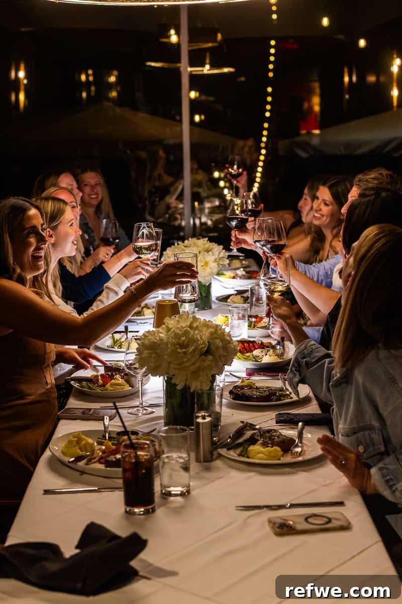 Fresh Air Retreat Recap: Highlights from Atlanta, GA 29 girls doing a dinner cheers.