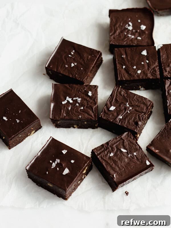 Creamy Greek Yogurt Chocolate Mousse Recipe for Decadent Dessert 11 raw chocolate brownies cut up in squares on parchment paper