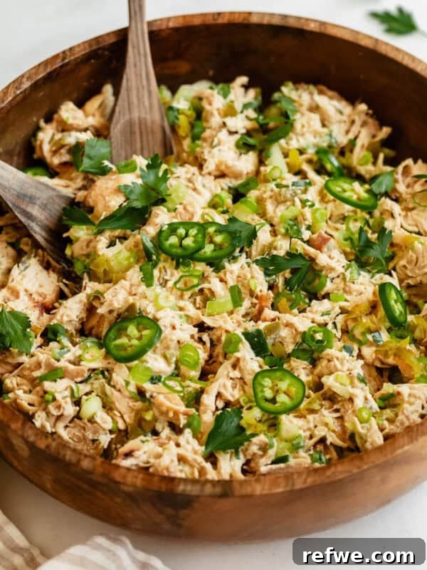 Chewy Rice Paper Mochi Recipe: Step-by-Step Homemade Treat 12 A close-up of jalapeno popper chicken salad in a wooden bowl, topped with sliced jalapeños, green onions, and fresh herbs.