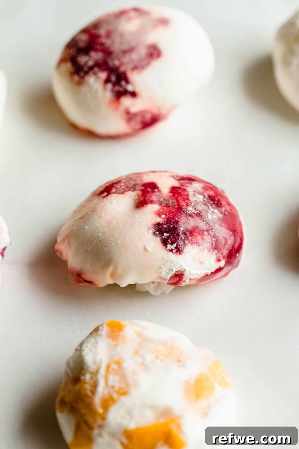 Chewy Rice Paper Mochi Recipe: Step-by-Step Homemade Treat 9 Three rice paper mochi balls filled with strawberry, blueberry and mango