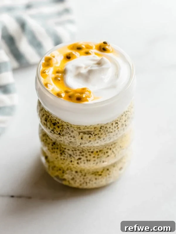 Creamy Passionfruit Chia Pudding Recipe for Breakfast & Dessert 11 passionfruit chia pudding in a jar topped with yogurt and passionfruit.
