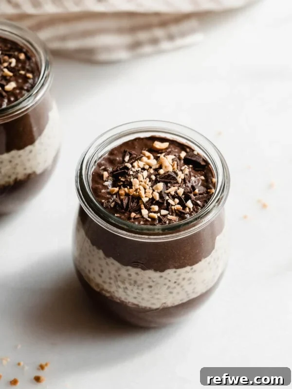 Creamy Passionfruit Chia Pudding Recipe for Breakfast & Dessert 13 A cup of chocolate peanut butter chia pudding topped with chocolate and peanut butter.