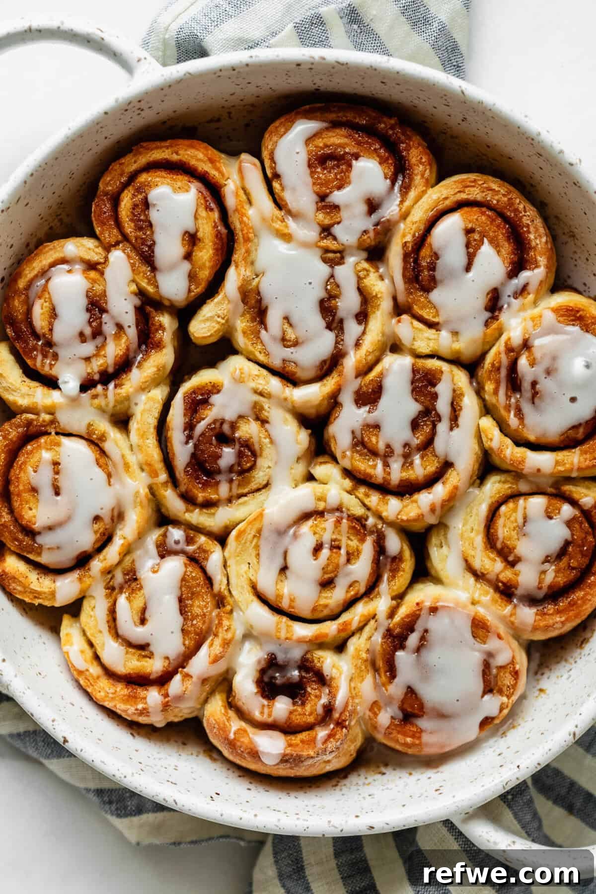 Cottage Cheese Cinnamon Rolls Recipe: Soft and Fluffy 12 Overhead view of glazed cottage cheese cinnamon rolls with cream cheese icing.