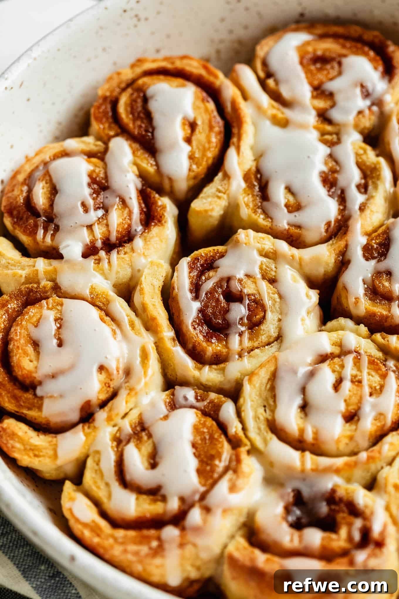 Cottage Cheese Cinnamon Rolls Recipe: Soft and Fluffy 13 Close-up of glazed cottage cheese cinnamon rolls with icing drizzle.