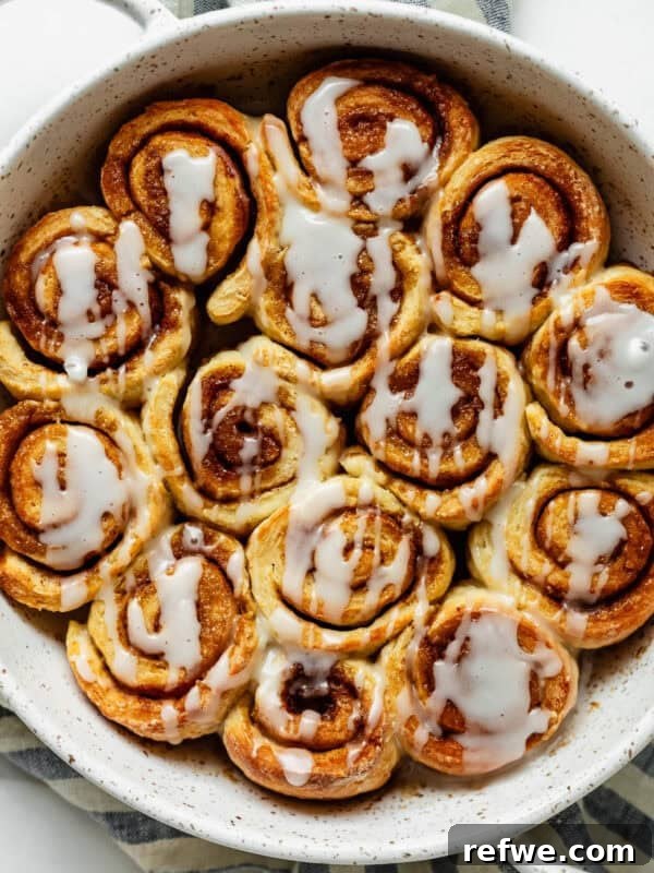 Cottage Cheese Cinnamon Rolls Recipe: Soft and Fluffy 14 Overhead view of glazed cottage cheese cinnamon rolls with cream cheese icing.