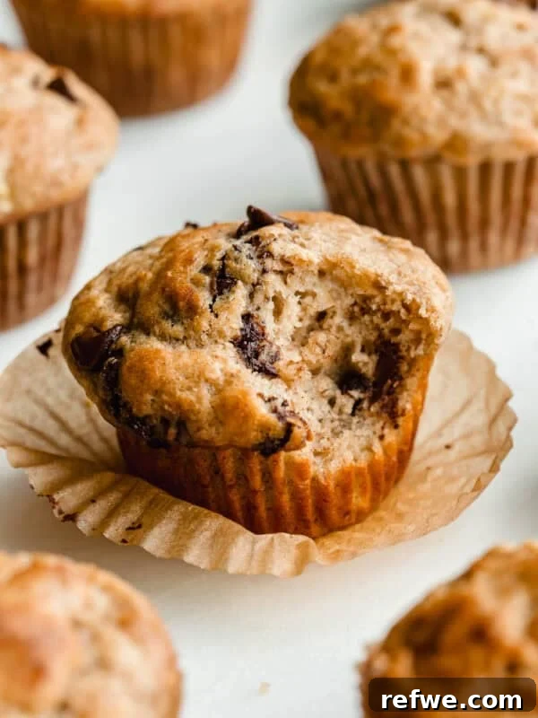 Cottage Cheese Cinnamon Rolls Recipe: Soft and Fluffy 17 A cottage cheese banana muffins with chocolate chips with a bite taken out of it.