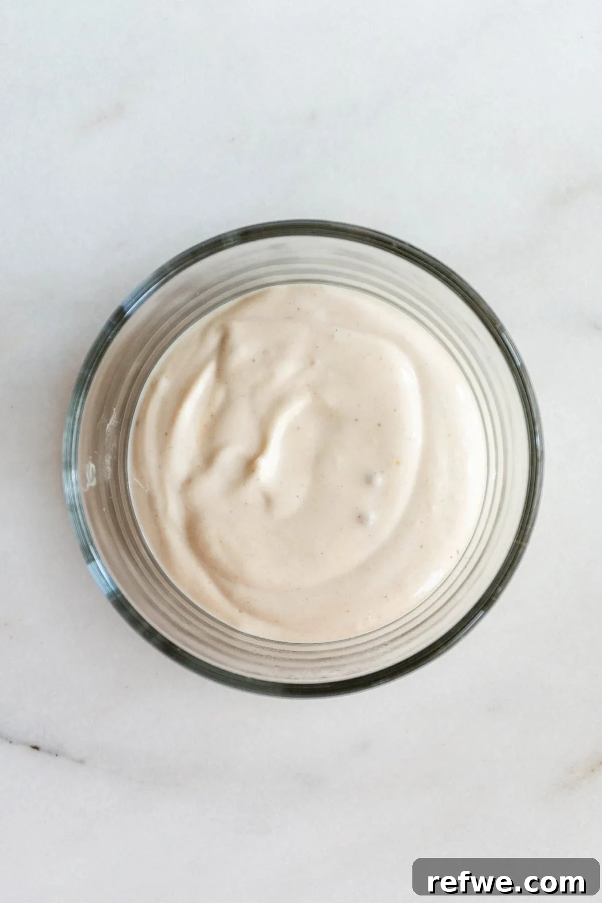High-Protein Banana Yogurt Pudding Recipe with Greek Yogurt 5 Greek yogurt in a clear bowl.