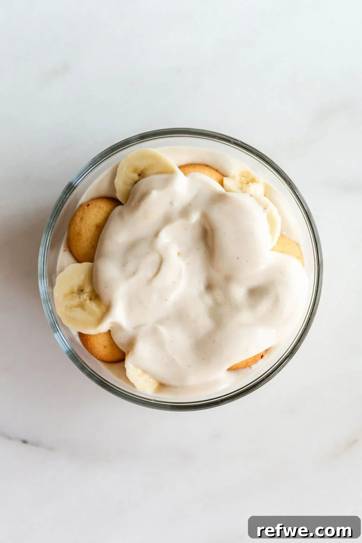 High-Protein Banana Yogurt Pudding Recipe with Greek Yogurt 8 High protein banana pudding served in a glass container.