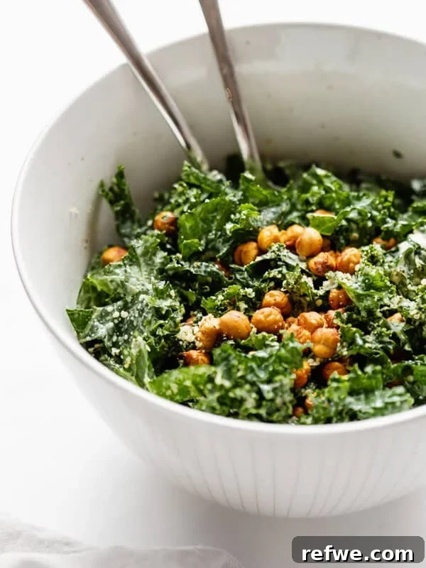a serving bowl of kale Caesar salad topped with crispy chickpeas